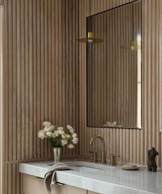 light wood tambour panelling in bathroom