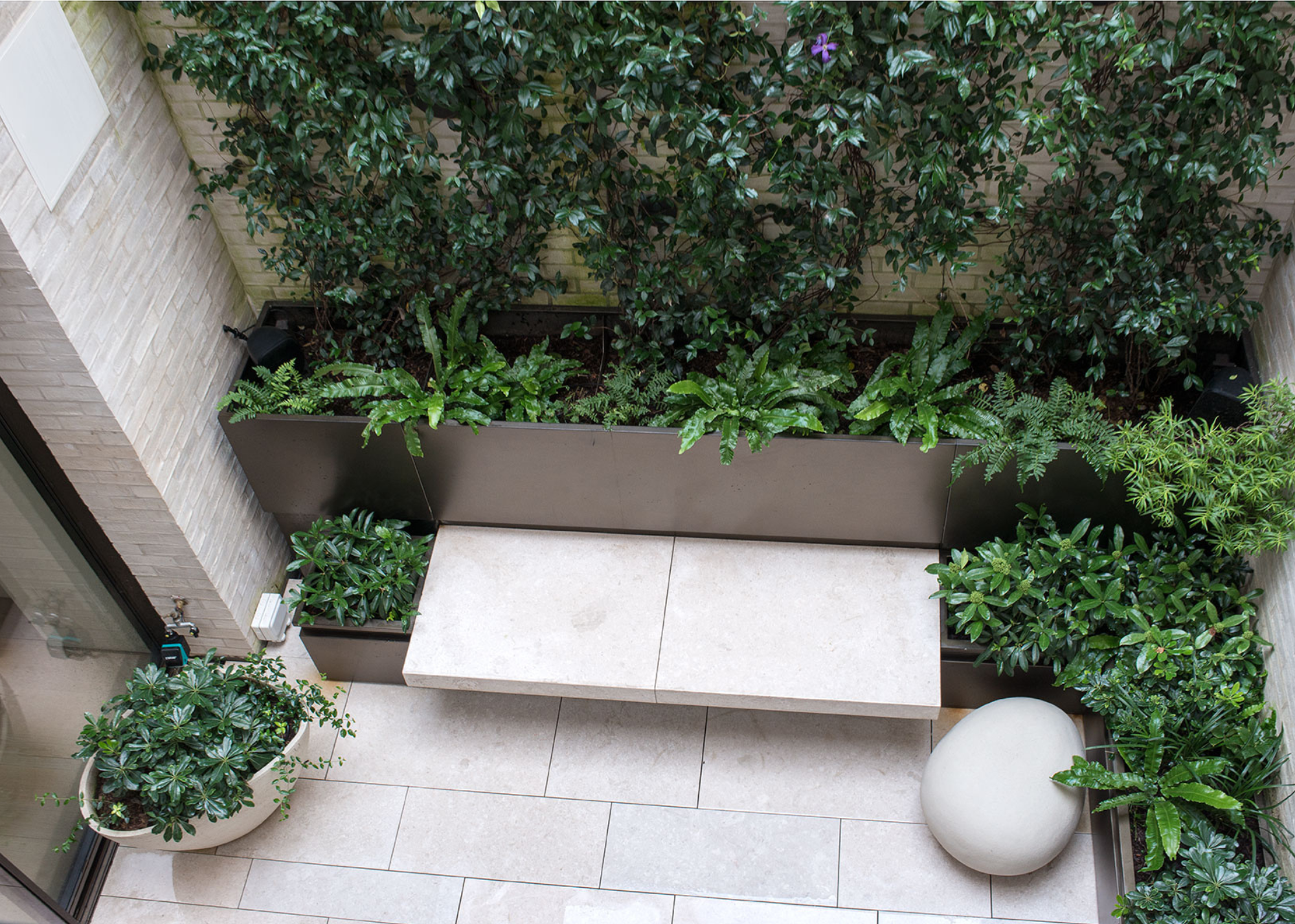 birds eye view of a natural stone paved garden