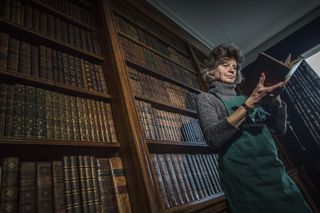 Caroline Bendix, book conservator, pictured at work at Houghton House, Little Houghton, Northamptonshire. ©Mark Williamson / Country Life