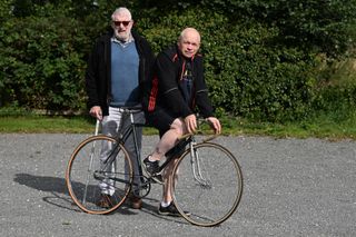 Andy Dougherty astride the BSA bicycle ridden by the Rugby Flyer Ralph Dougherty, accompanied by Maurice Dougherty