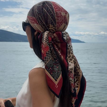 Alexis Badiyi on a boat wearing a headscarf and a white shirt