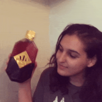 Finger, Brown, Forehead, Eyebrow, Wrist, Black hair, Bottle, Long hair, Thumb, Brown hair,