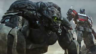 Optimus Primal and Optimus Prime stand together in Transformers: Rise of the Beasts