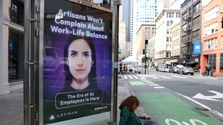 An advertisement for the AI company Artisan is posted on 2nd Street on in San Francisco, California.