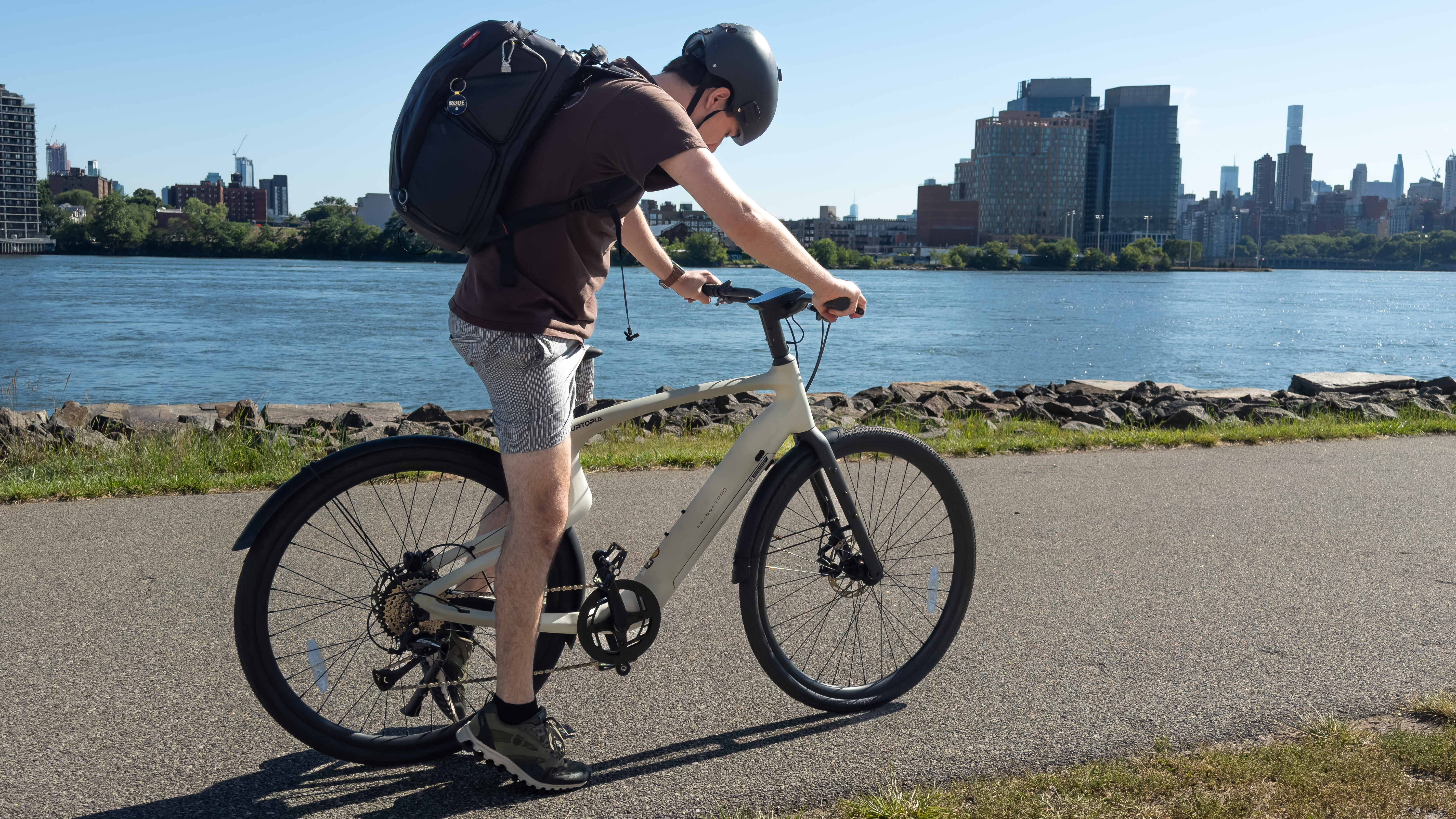 Paul Antill riding the Urtopia Carbon 1 Pro electric bike along the waterfront