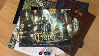 Final Fantasy XIV TTRPG Starter Set box and contents on a wooden surface