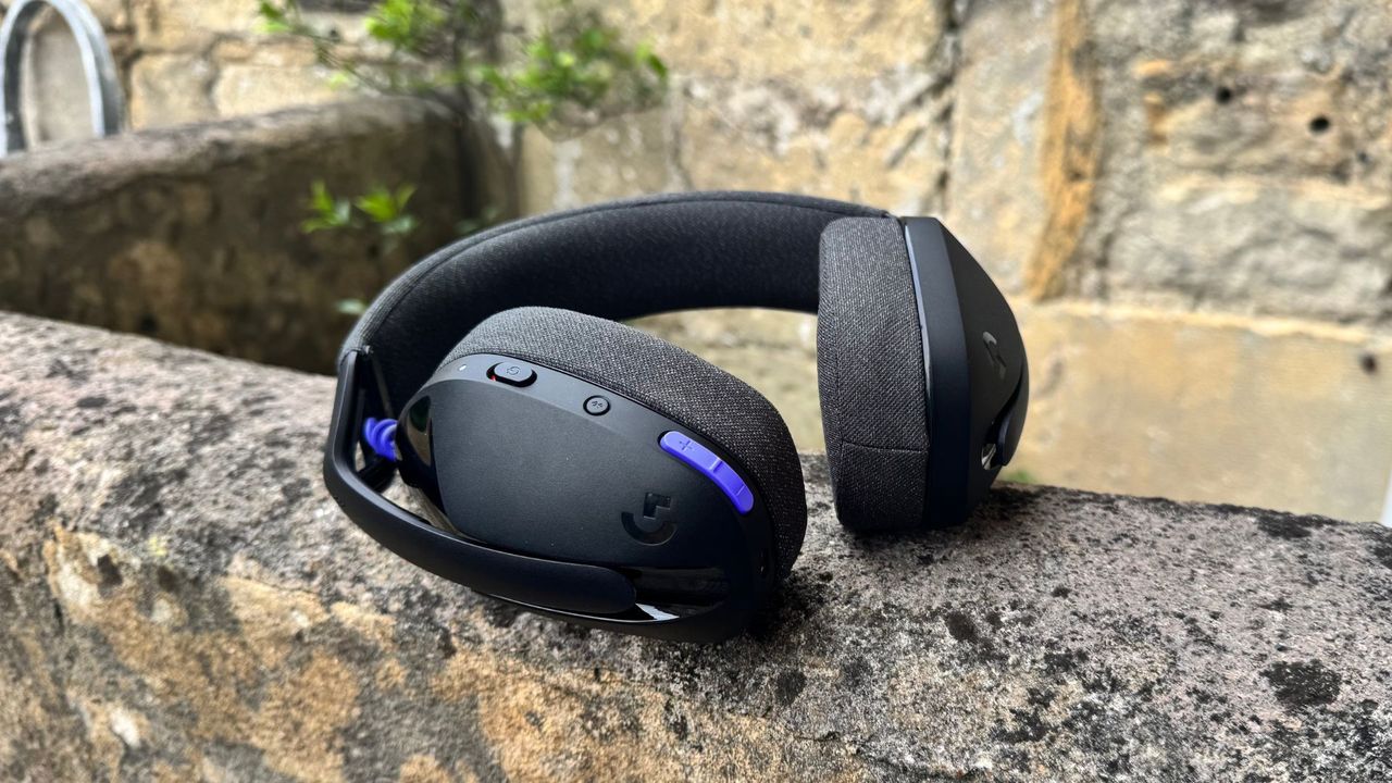 Logitech G321 Lightspeed gaming headset on its side on a stone wall.