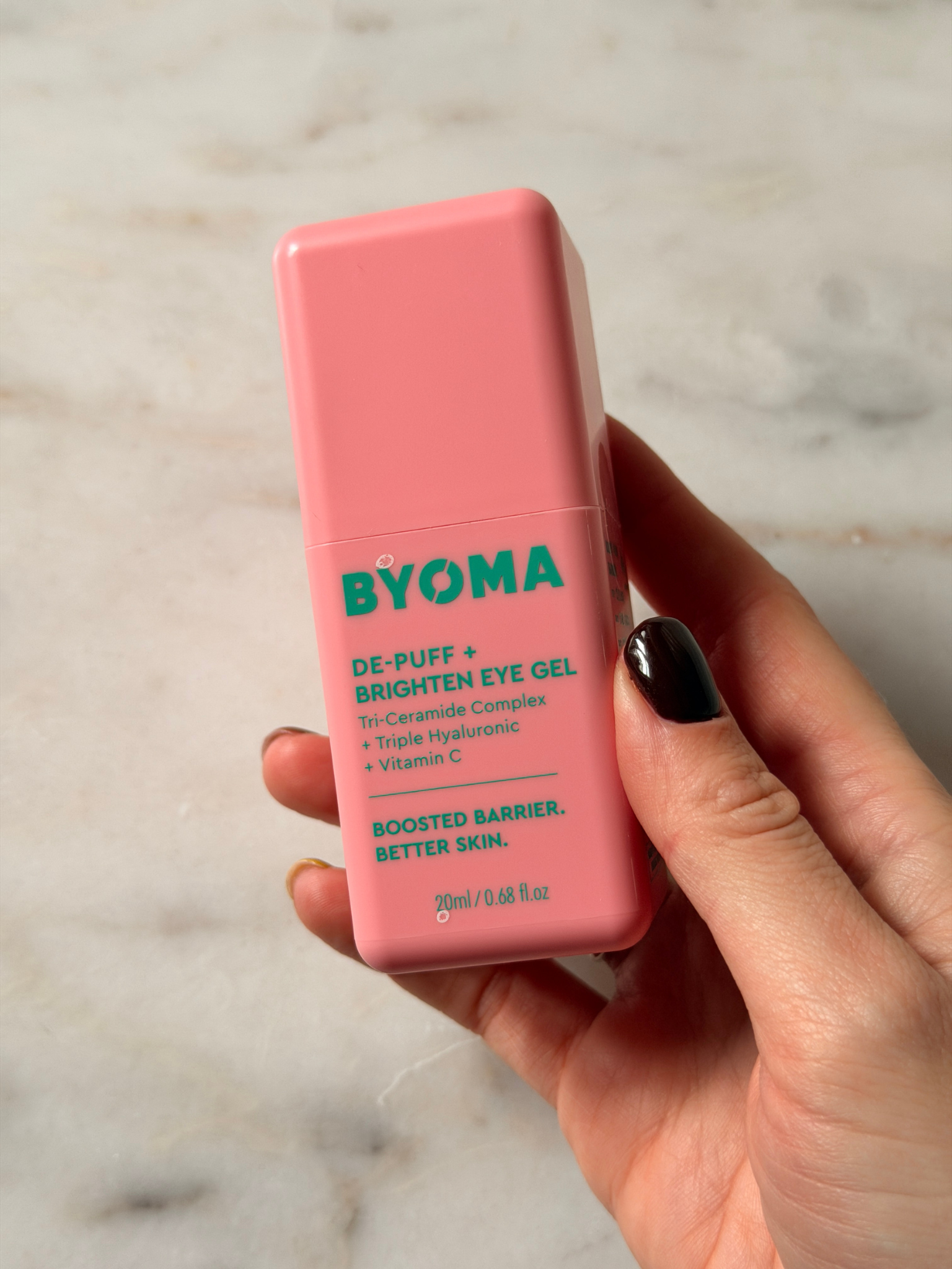 Freelance beauty editor Grace Day holding the Byoma eye cream