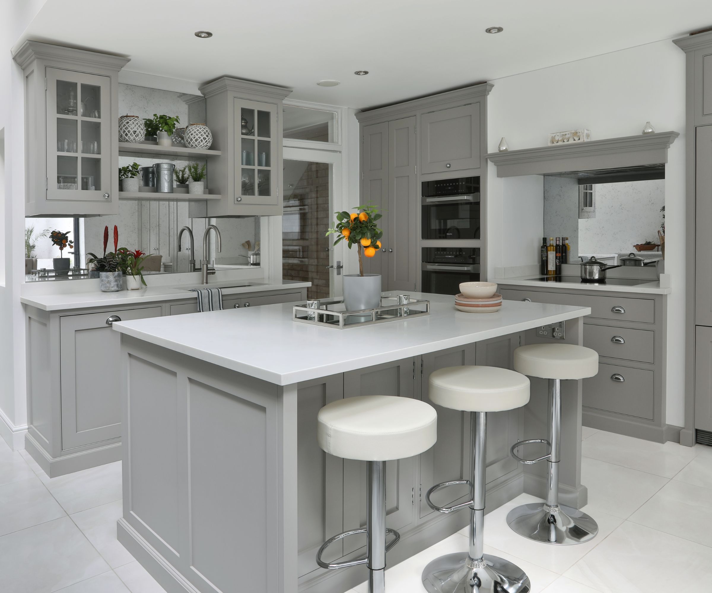 Classic grey shaker kitchen with central island and bar stools