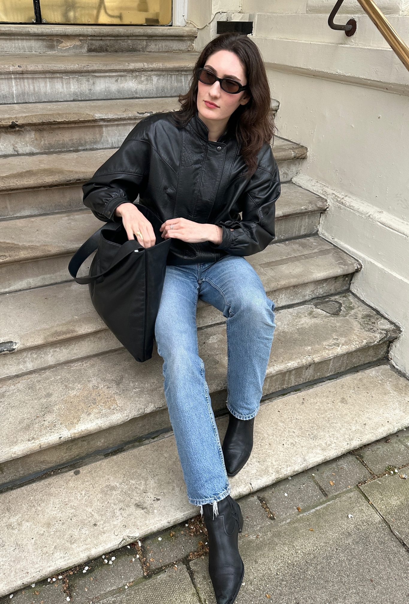 @natalieemunro wearing a leather jacket outfit.