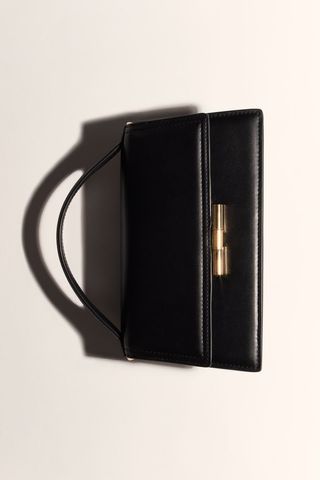 black crossbody bag with gold hardware