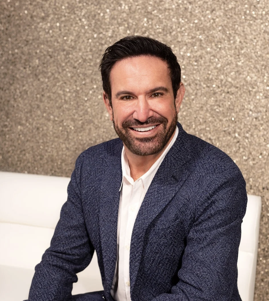 Dr. Sands in a dark suit and white shirt