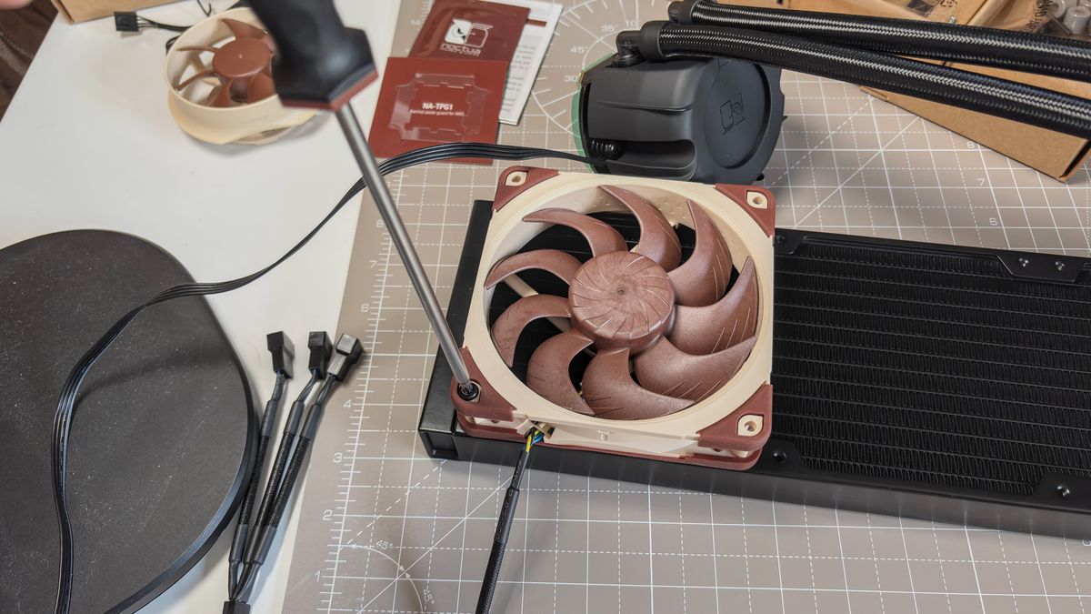A Noctua NL-LC1 liquid cooler being installed on a test bench for testing.