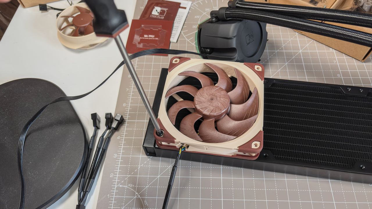 A Noctua NL-LC1 liquid cooler being installed on a test bench for testing.