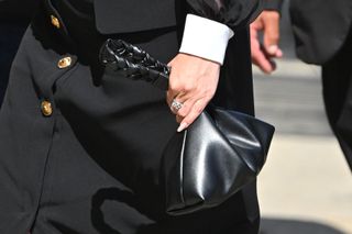 Selena Gomez carrying a black bag