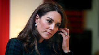 Kate Middleton touches her hair as she visits Dundee to officially open the V&A Dundee on January 29, 2019 in Dundee, Scotland.
