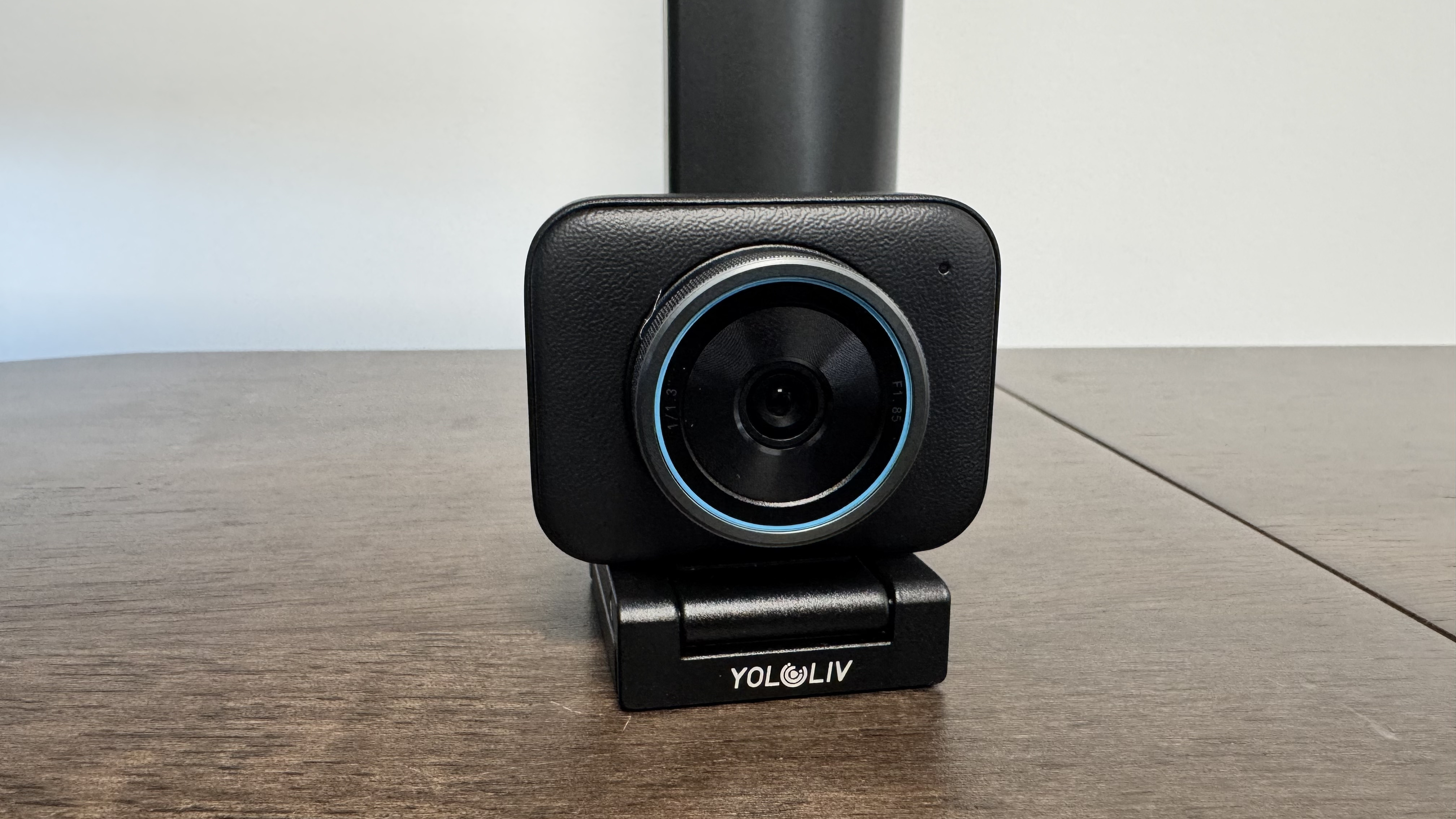 The Yololiv YoloCam S3 4K webcam on its stand on a wooden table