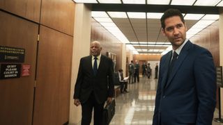 Manuel Garcia-Rulfo as Mickey in the halls of a courthouse in The Lincoln Lawyer season 3