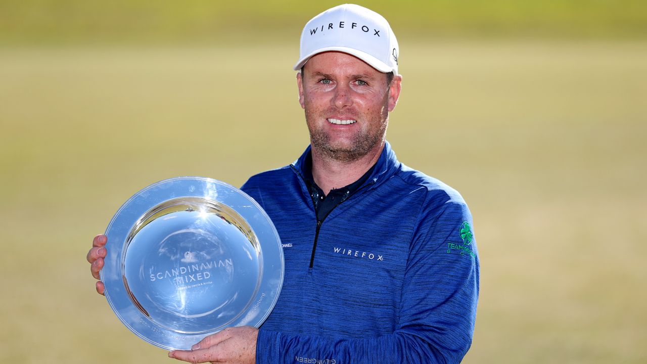 Jonathan Caldwell Poses with the trophy after winning the 2021 Scandinavian Mixed