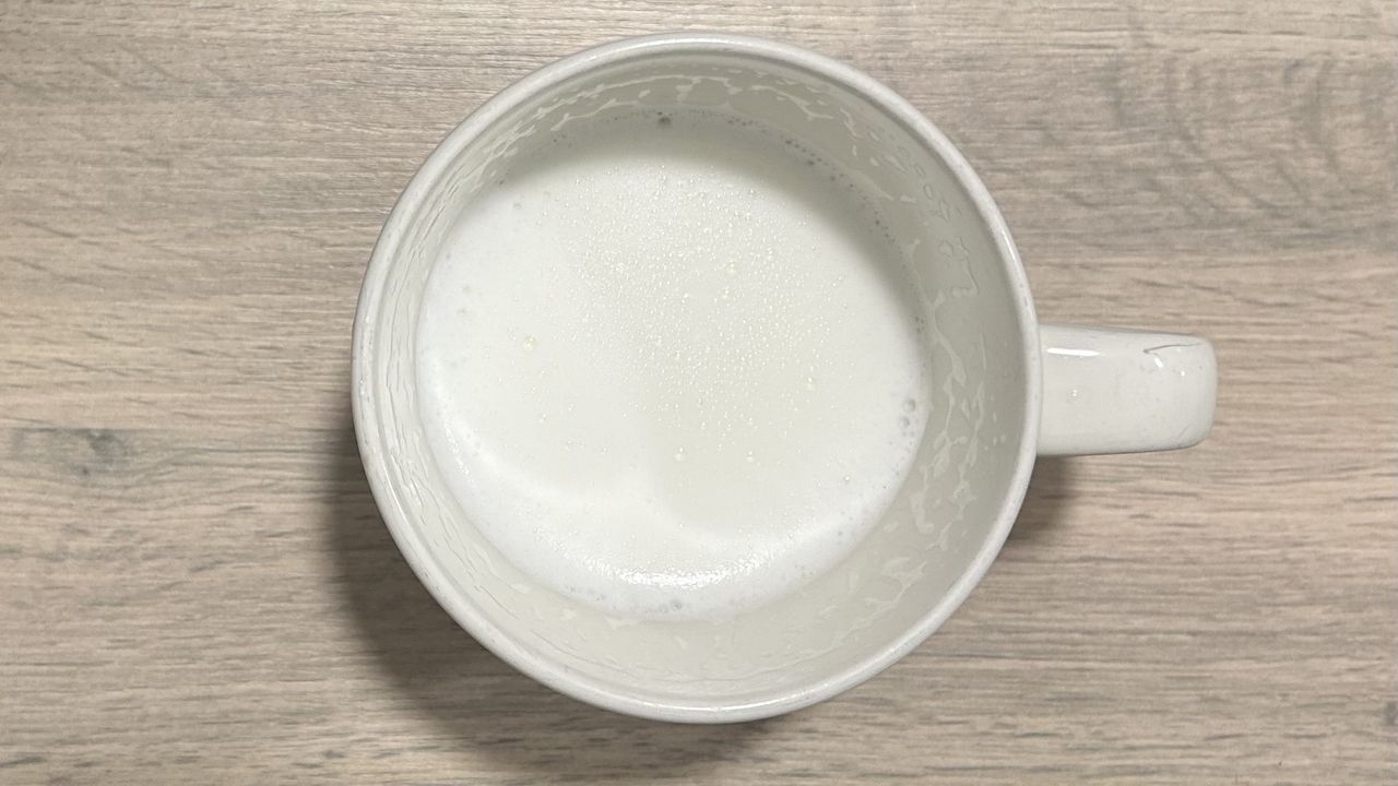 Warm cow's milk after frothing with Subminimal NanoFoamer Lithium.