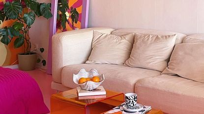 Colorful living room with cream couch