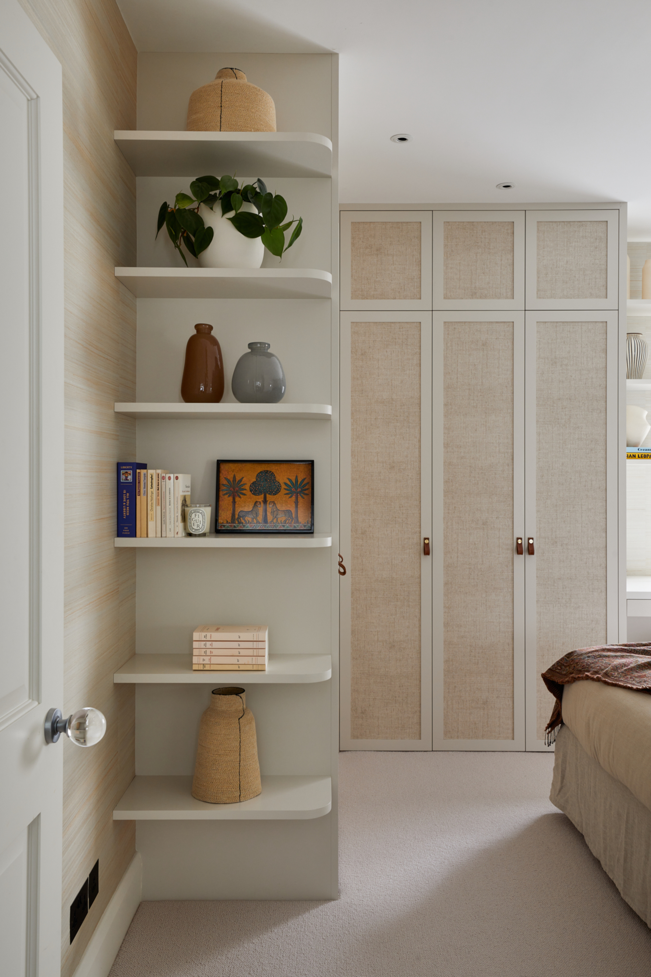 Beige bedroom with built-in wardrobe with linen detail