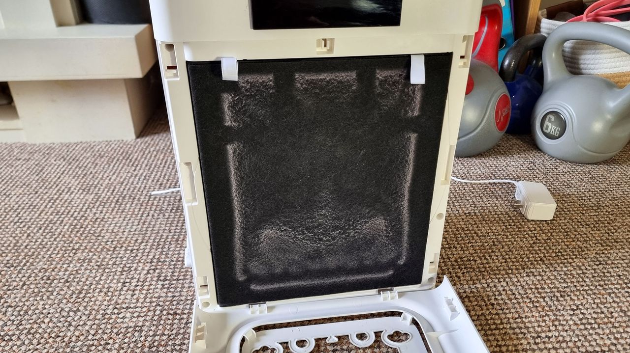 A picture of the dust and hair collected on the air filter in the Oneisall Pet Air Purifier