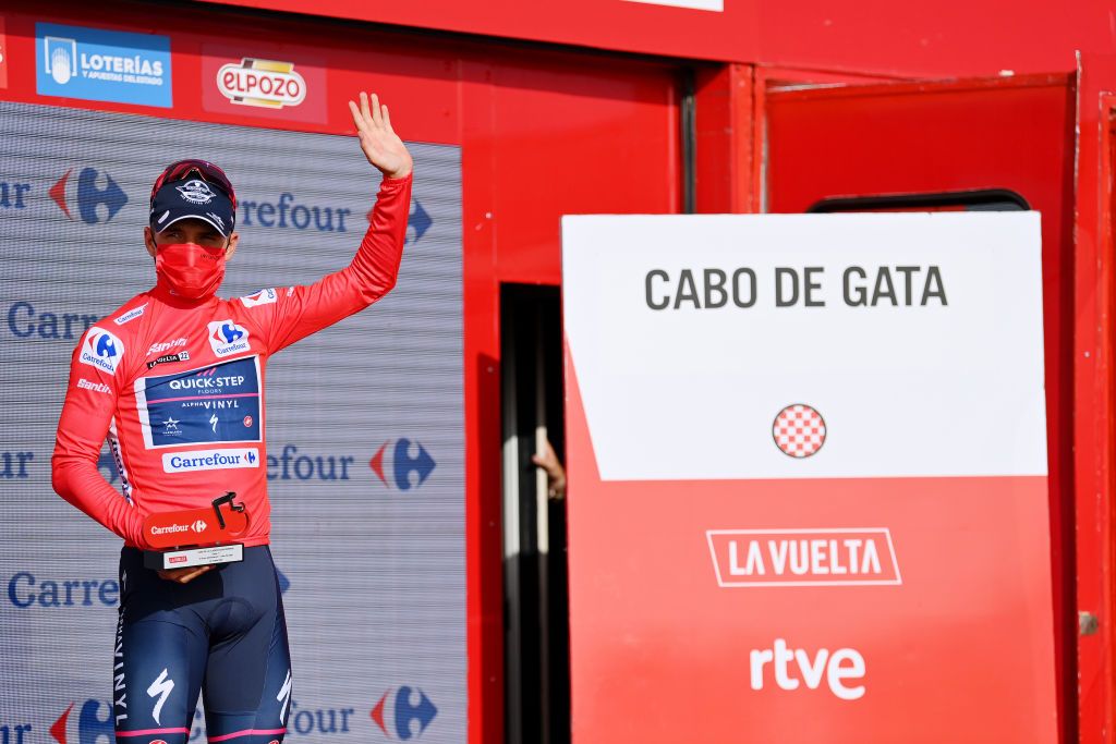 CABO DE GATA SPAIN AUGUST 31 Remco Evenepoel of Belgium and Team QuickStep Alpha Vinyl celebrates winning the Red Leader Jersey on the podium ceremony after the 77th Tour of Spain 2022 Stage 11 a 1912km stage from ElPozo Alimentacin Alhama de Murcia to Cabo de Gata LaVuelta22 WorldTour on August 31 2022 in Cabo de Gata Spain Photo by Justin SetterfieldGetty Images