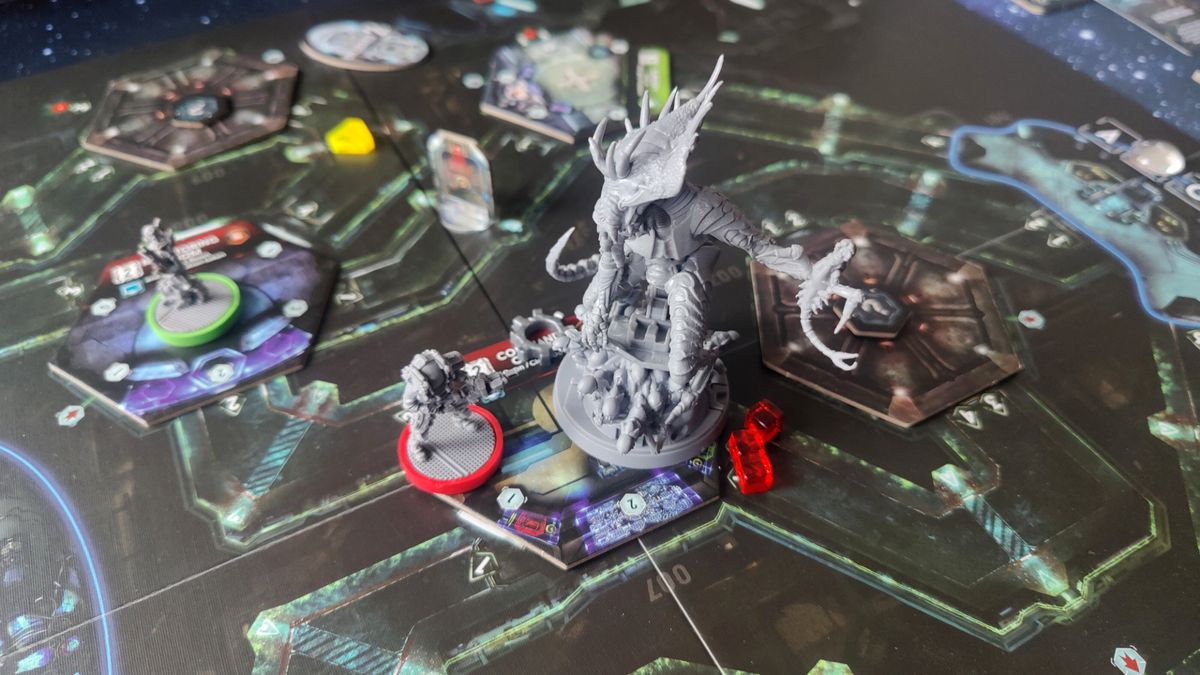 Nemesis board game models and tokens laid out on a board