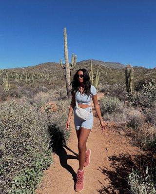 Woman wearing hiking clothing.