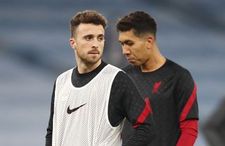 Diogo Jota, left, and Roberto Firmino are injury doubts for the Carabao Cup final against Chelsea on Sunday (Clive Brunskill/PA)