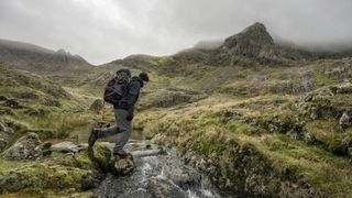 what to do if you get lost hiking: hiker below Clogwyn y Person in Snowdonia