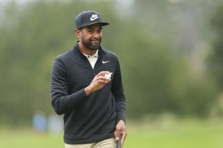 Tony Finau waves to the crowd