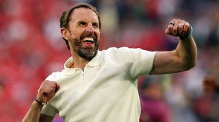 Gareth Southgate celebrates after England's win over Switzerland on penalties at Euro 2024.