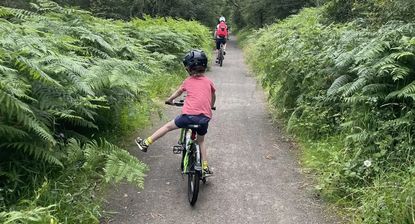 Child riding with a parent up ahead