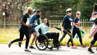 Runners and a wheelchair user take part in the Wings for Life World Run App Run in Johannesburg, South Africa, on May 7, 2023.