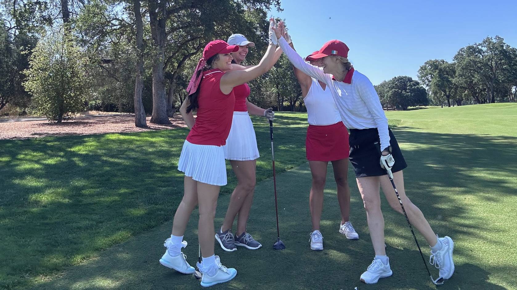 Female golfers celebrating
