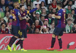 Lionel Messi, left, netted his 51st career hat-trick in the win over Real Betis