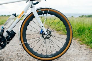 New fulcrum sharq wheels fitted to a white Fairlight bike on a gravel track