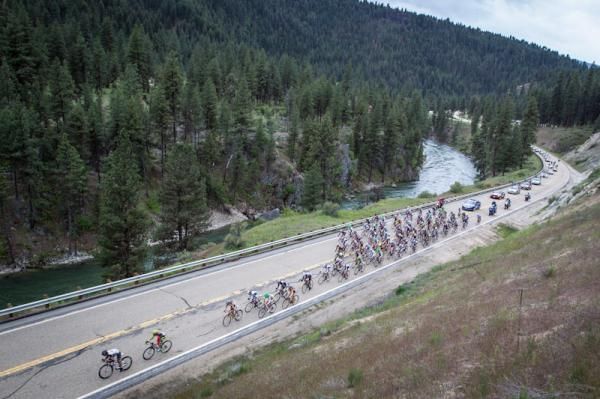 The peloton rides along the Payette River