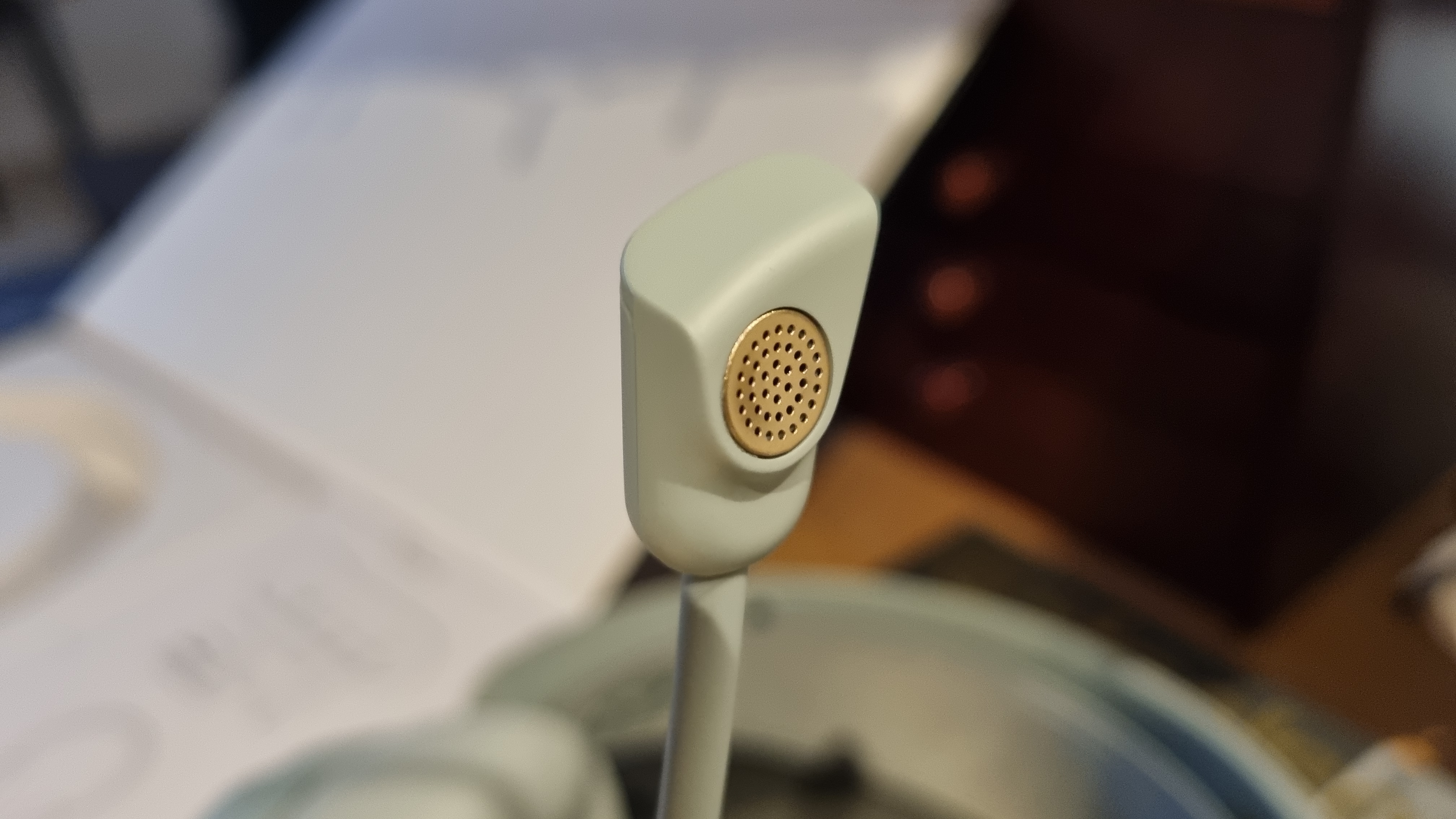 The boom microphone capsule on the The SteelSeries Arctis Nova Elite gaming headset, replete in gold