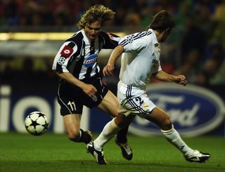 Juventus midfielder Pavel Nedved is challenged by Real Madrid's Michel Salgado in the Champions League semi-finals in May 2003.