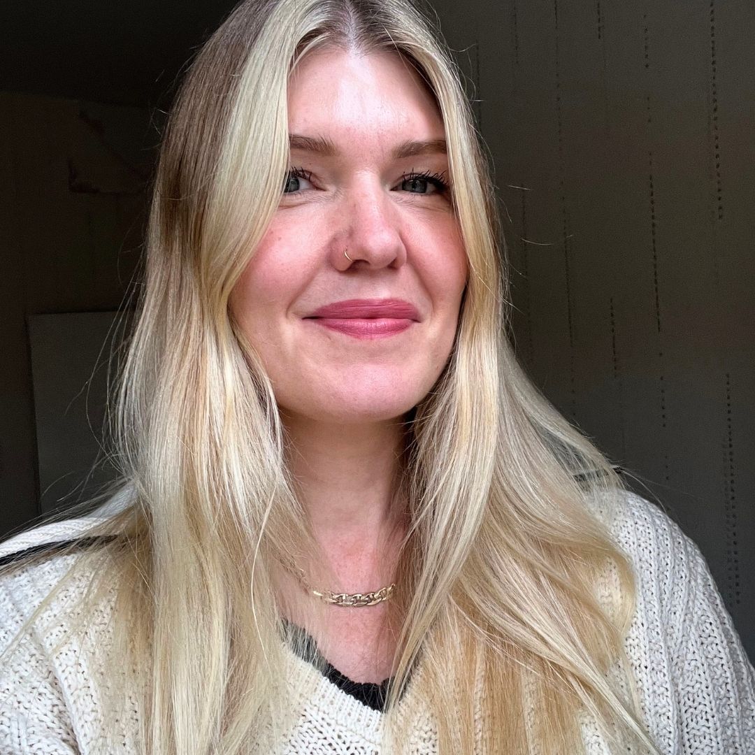 beauty editor Fiona McKim in a cream knitted top testing MD London The Numbers Hair products