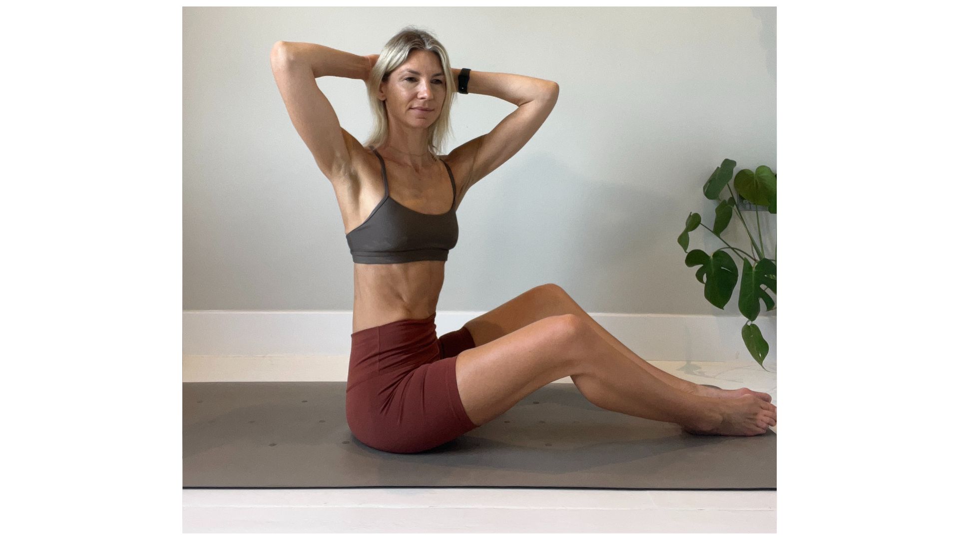 Shape Pilates founder Gemma Folkard demonstrating a spine twist