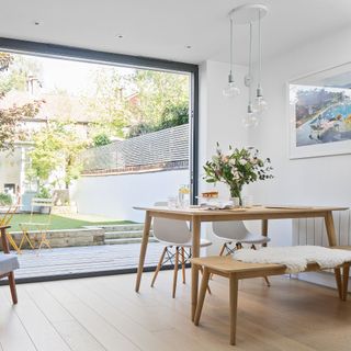 white scandi style dining table in bright space