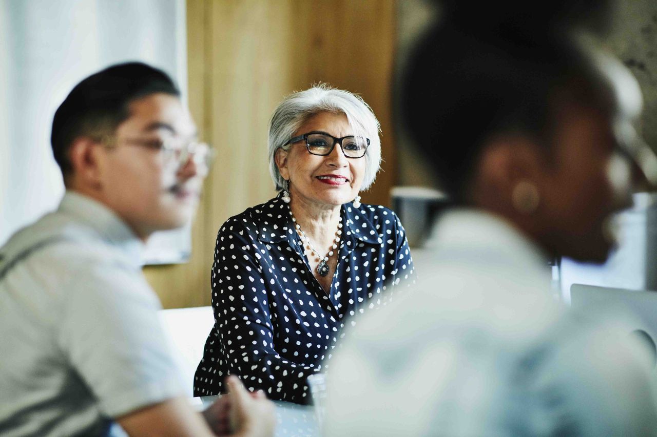 older woman in a work meeting