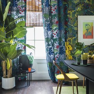 modern home dining room with tropical print curtains