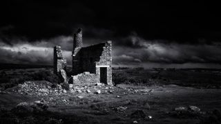 Black and white tumbledown building photographed using a Leica