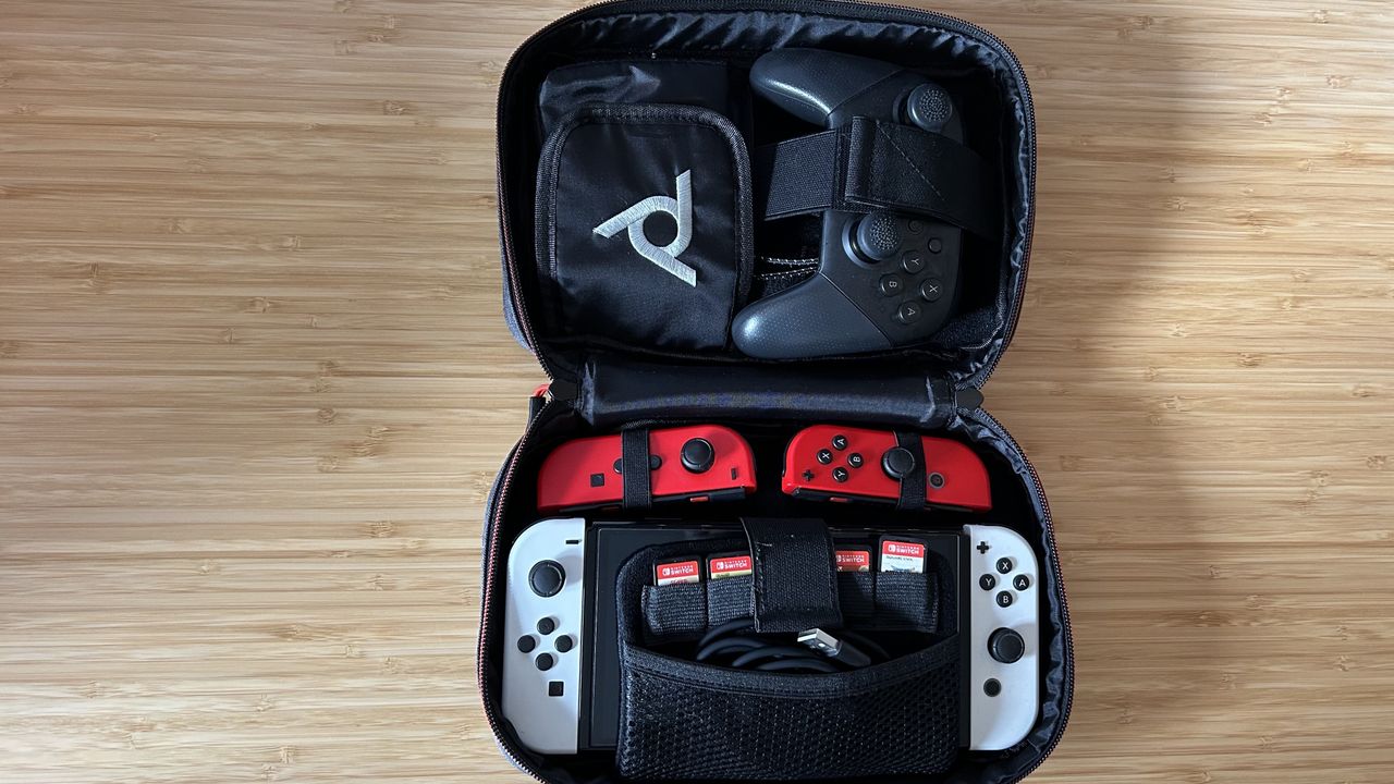 PDP commuter case open with Nintendo Switch, Joy-Con, games, and Pro Controller stored inside