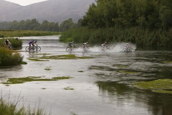 Riders cross the Breede River at the start of stage 2